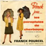 NS0xMTU3LmpwZWc.jpeg Franck Joue... Les Parapluies De Cherbourg = Los Paráguas De Cherburgo