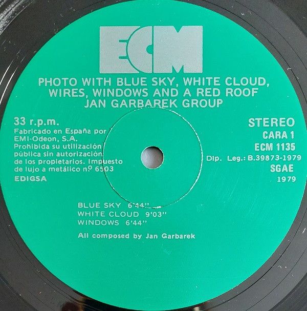 Photo With Blue Sky, White Cloud, Wires, Windows And A Red Roof