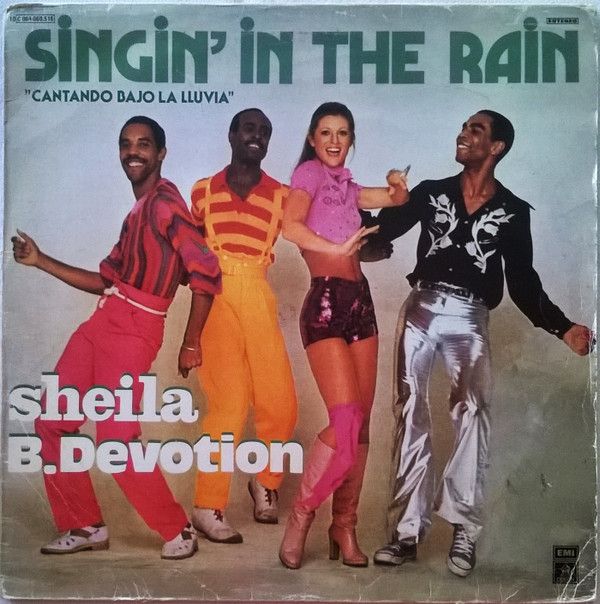 Singin' In The Rain = Cantando Bajo La Lluvia